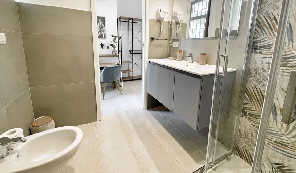 Double Room | Bathroom | Shower, hair dryer, bidet, towels