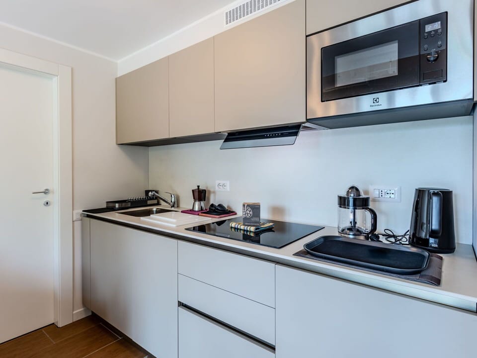 Interior Design, Cabinetry, Countertop, Kitchen, Flooring, Apartment, Room, Major Appliance, Drawer