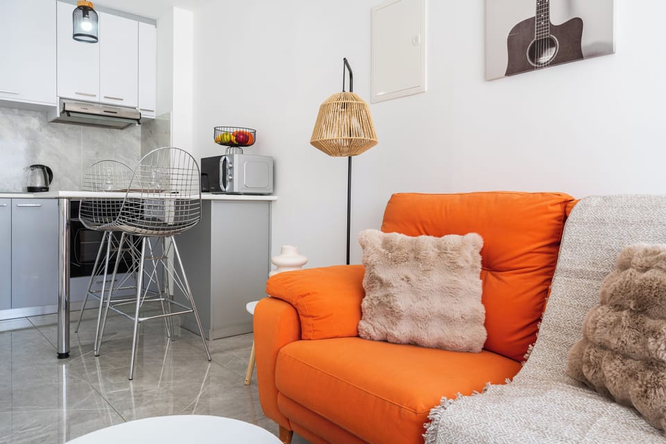 Apartment, 1 Bedroom, City View, Mezzanine | Living room | 43-inch Smart TV with digital channels, streaming services