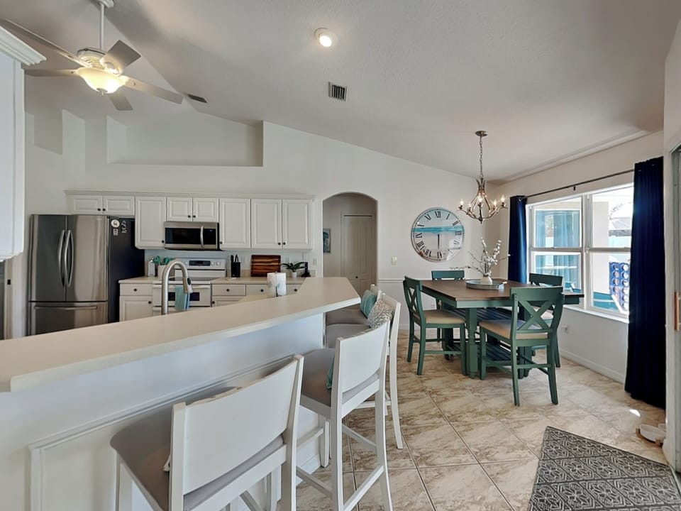 Fully Equipped Kitchen + Breakfast Bar Seating for Four