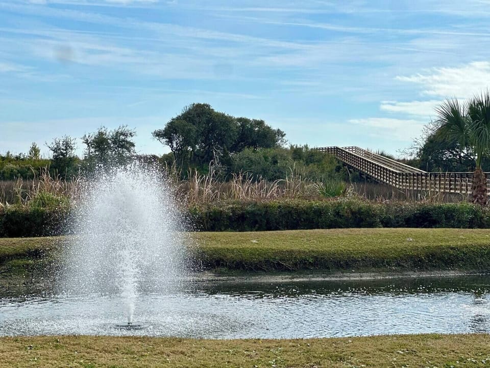 Serene lagoon views, a gentle fountain, and a beautiful beach boardwalk create a peaceful, romantic setting for your stay.