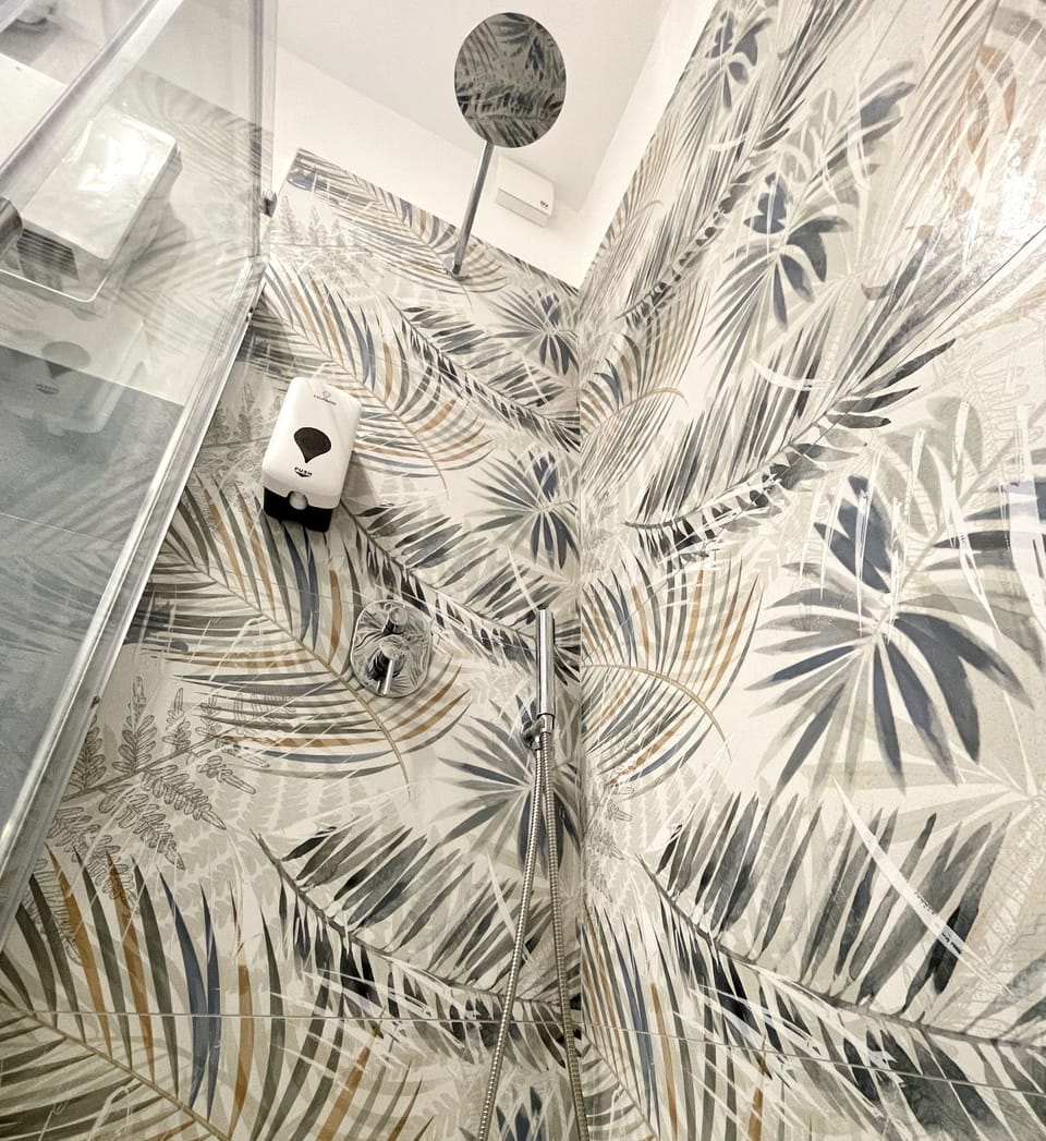 Double Room | Bathroom | Shower, hair dryer, bidet, towels
