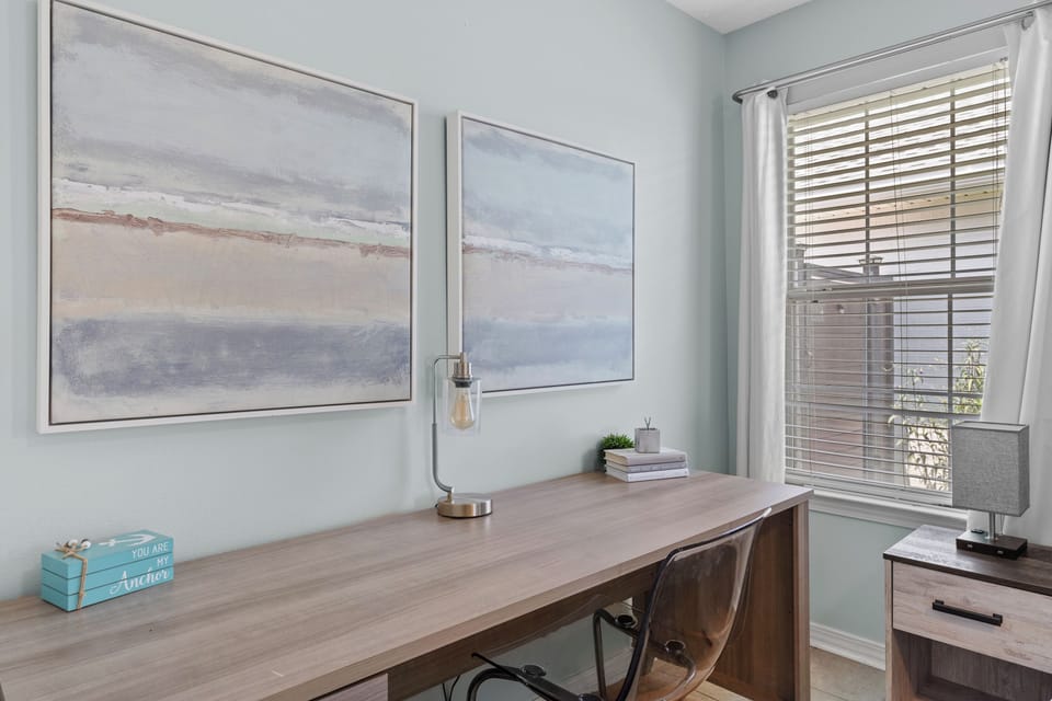 Bedroom #1 also includes a writing desk.