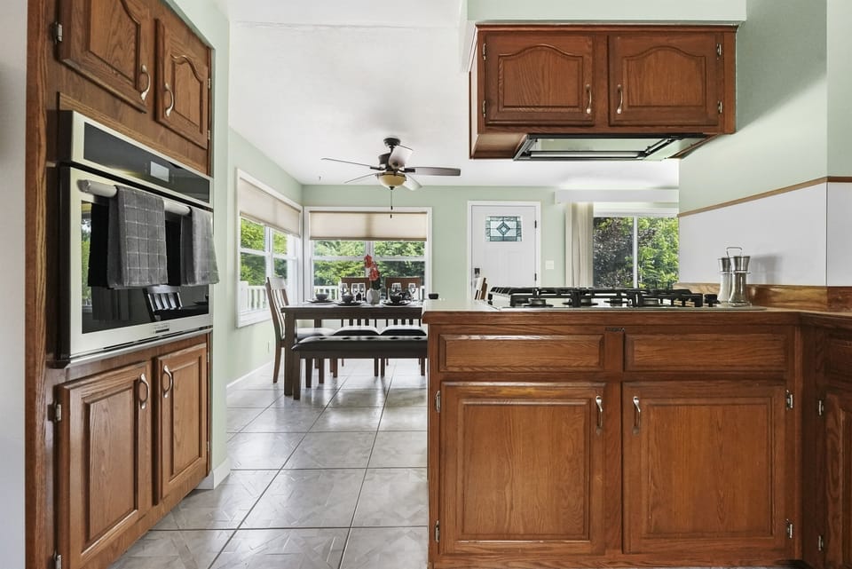 Bright and airy open kitchen layout seemlessly blending cooking and dining spaces