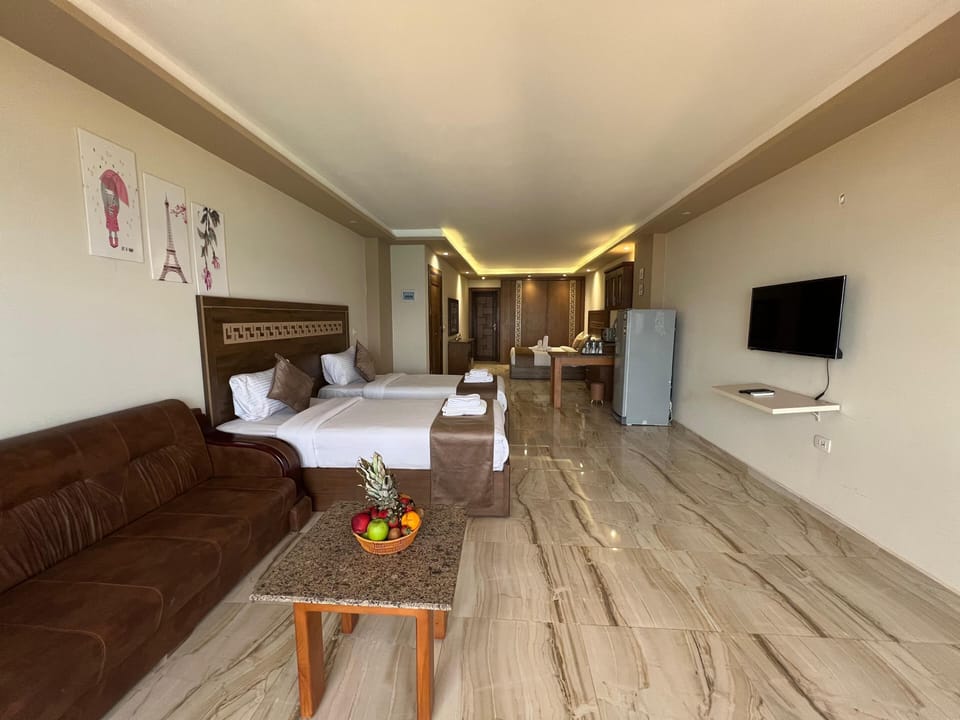 Classic Quadruple Room, Sea View | In-room safe, desk, laptop workspace, blackout drapes