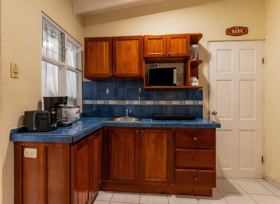 Apartment, Multiple Beds, Patio, Garden View (Villas Paraiso B52) | Private kitchen | Fridge, microwave, stovetop, cookware/dishes/utensils