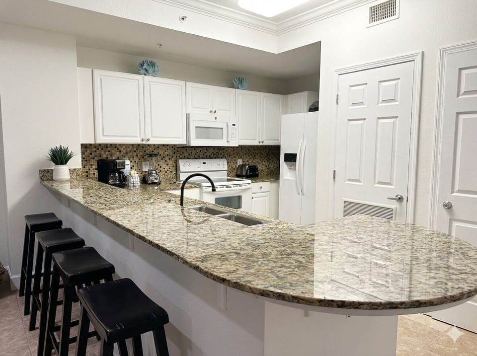 Full Kitchen with dishwasher, coffee makers, blender, everything you need. 