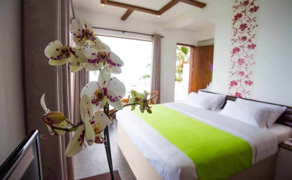 Deluxe Double Room, Balcony, Sea View | In-room safe, blackout drapes, soundproofing, iron/ironing board