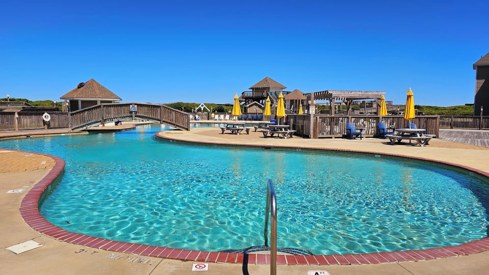 Shared outdoor community pool area with tons of beach access parking