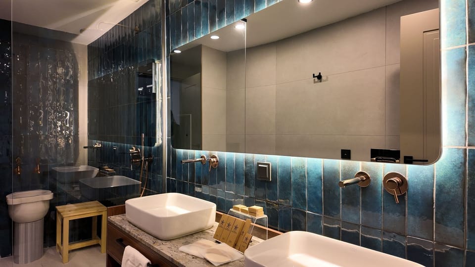 Suite, 1 King Bed with Sofa bed, Private Bathroom, City View | In-room safe, free WiFi, bed sheets