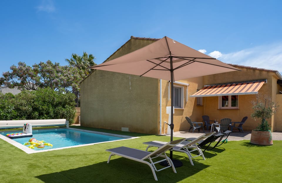 Large enclosed garden with swimming pool, sun loungers etc.