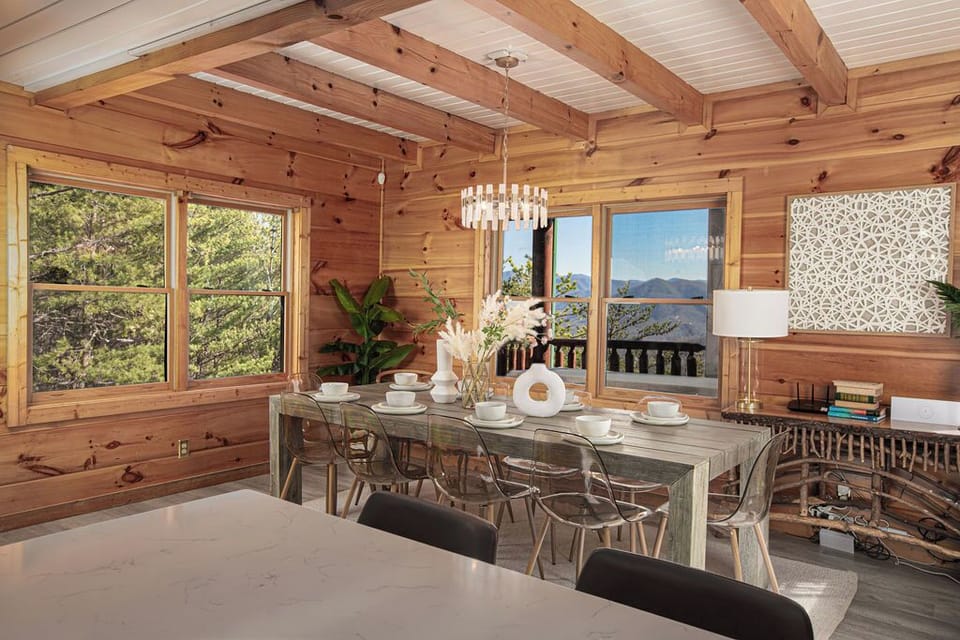Enjoy mountain meals in style at this spacious table with light-filled windows and cozy decor.