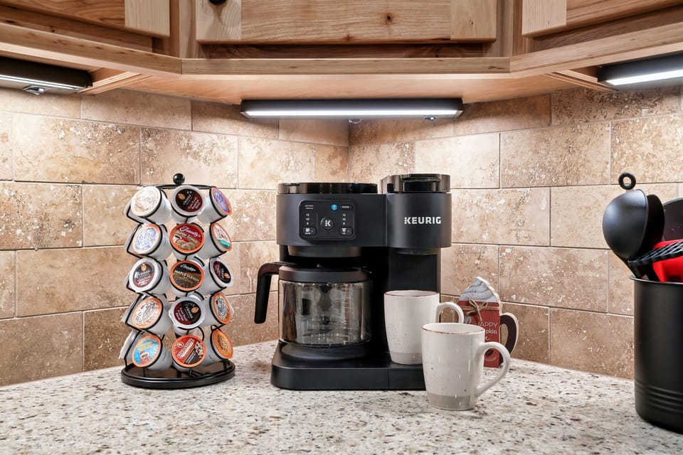 Start your mornings with the perfect brew using the Keurig coffee station, complete with a variety of pods for every taste.