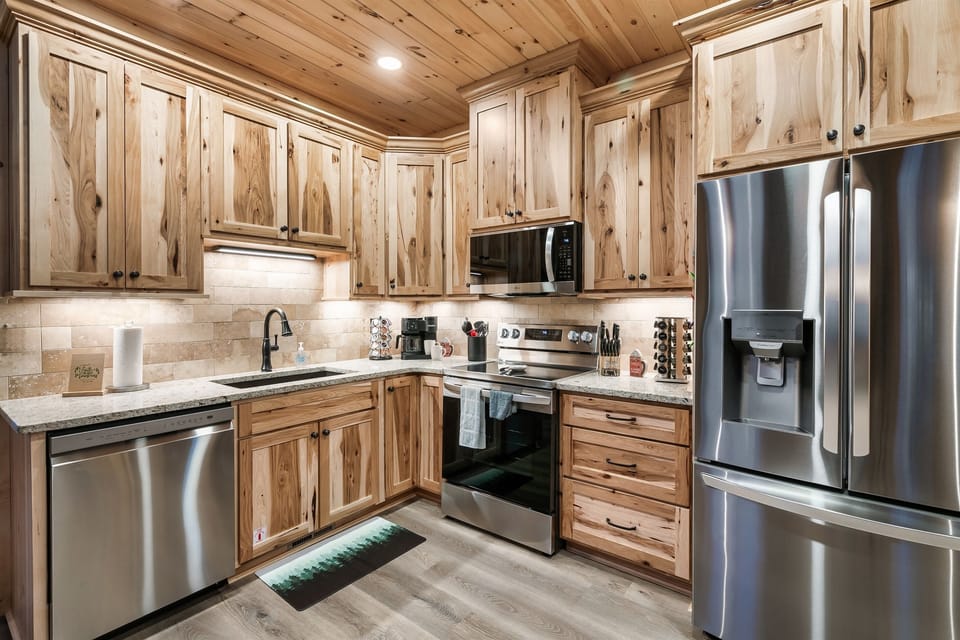 With ample counter space, a wine rack, and top-of-the-line appliances, this kitchen is ready to inspire your culinary creations.