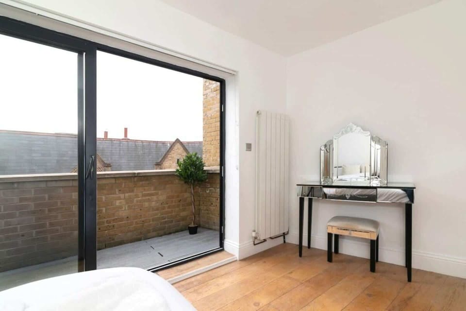Wake up in Bedroom 3 and step straight onto your private balcony—a peaceful retreat featuring a comfortable queen-size bed, elegant décor and a relaxing outdoor space
