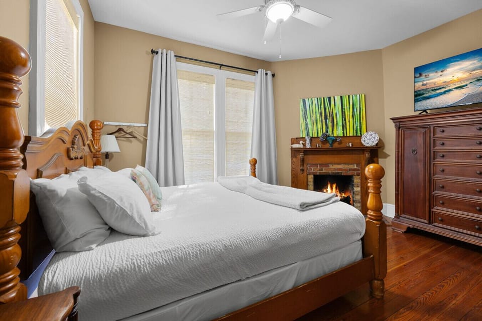 The beautiful Lady Clare Room with king bed, fireplace and TV. ADA Room