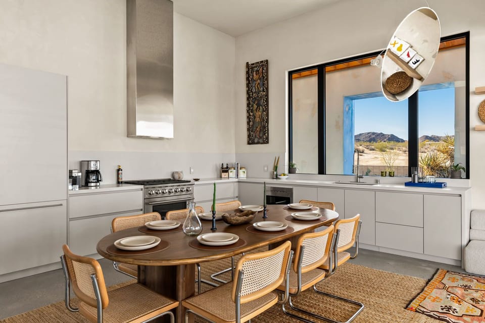 Moody interiors and state-of-the-art appliances art at the center of this dining area