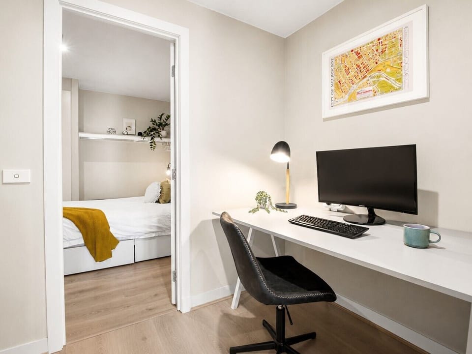 A snug desk area perfect for working with a warm cup of coffee.