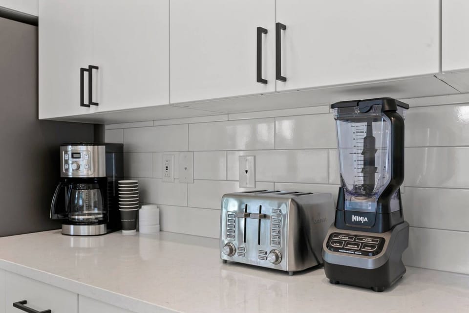 High-end stainless steel appliances (oven, stove, refrigerator, microwave)