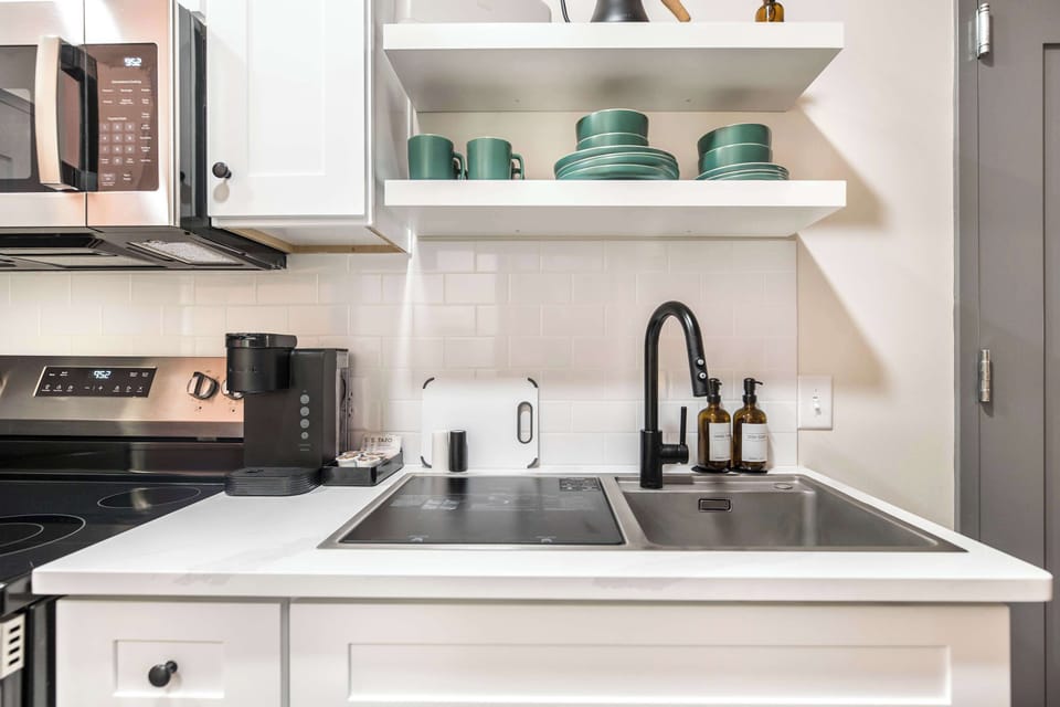 Enjoy a fully equipped kitchen with a Keurig, oven, microwave, sink, and all the essentials for a seamless stay