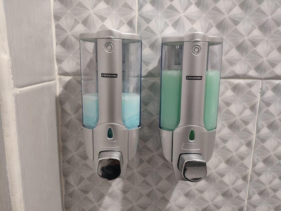 Shower, rainfall showerhead, bidet, towels