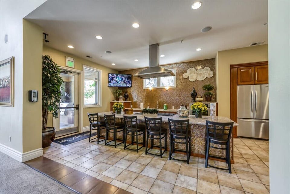 Spacious clubhouse kitchen available for guest use—perfect for hosting, meal prep, or simply enjoying a change of scenery during your stay.