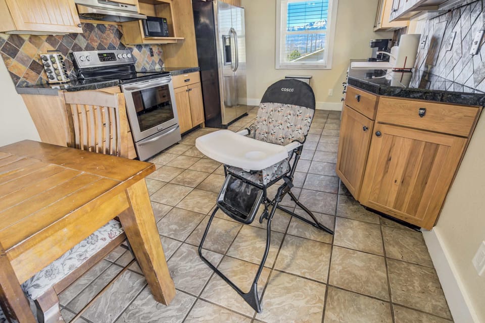 Family-friendly kitchen with a high chair available for little ones, making mealtime easy and convenient.




