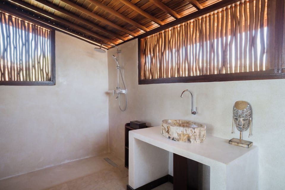 Deluxe Bungalow, Pool Access, Ocean View | Bathroom | Shower, hair dryer, bidet, towels