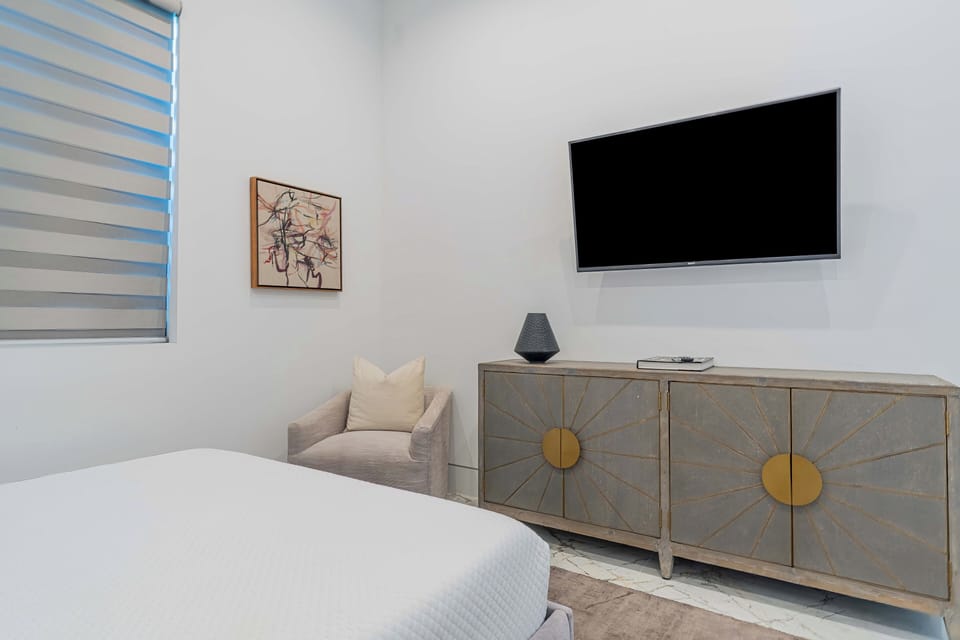 Bedroom 2 features a king bed, a twin bed, and an ensuite bathroom.