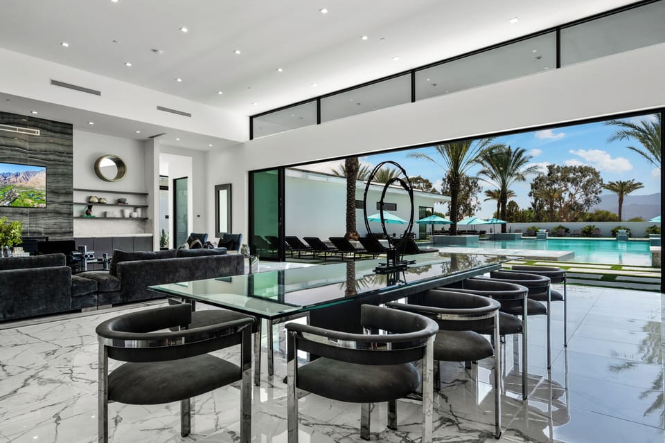 Grand great room with soaring ceilings and seamless indoor-outdoor flow.