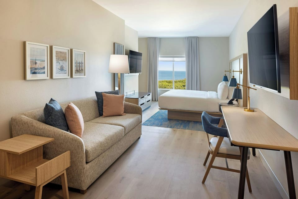 Suite, 1 King Bed with Sofa bed, Ocean View | Desk, laptop workspace, blackout drapes, iron/ironing board