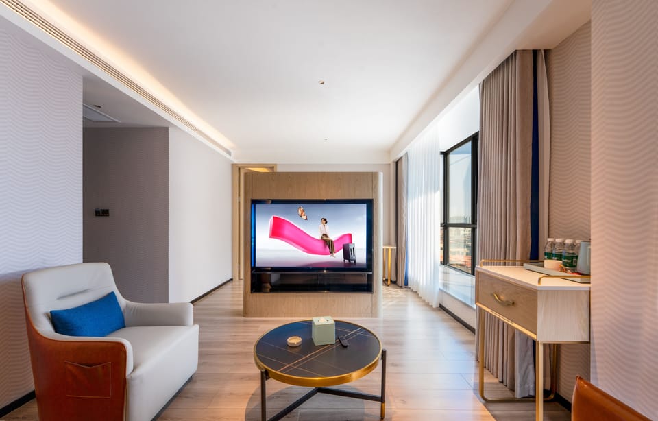 Executive Suite, City View | Living area | 55-inch LED TV with cable channels