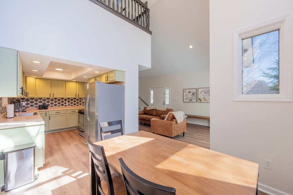 Open dining space with natural light and seamless flow to kitchen and living room.