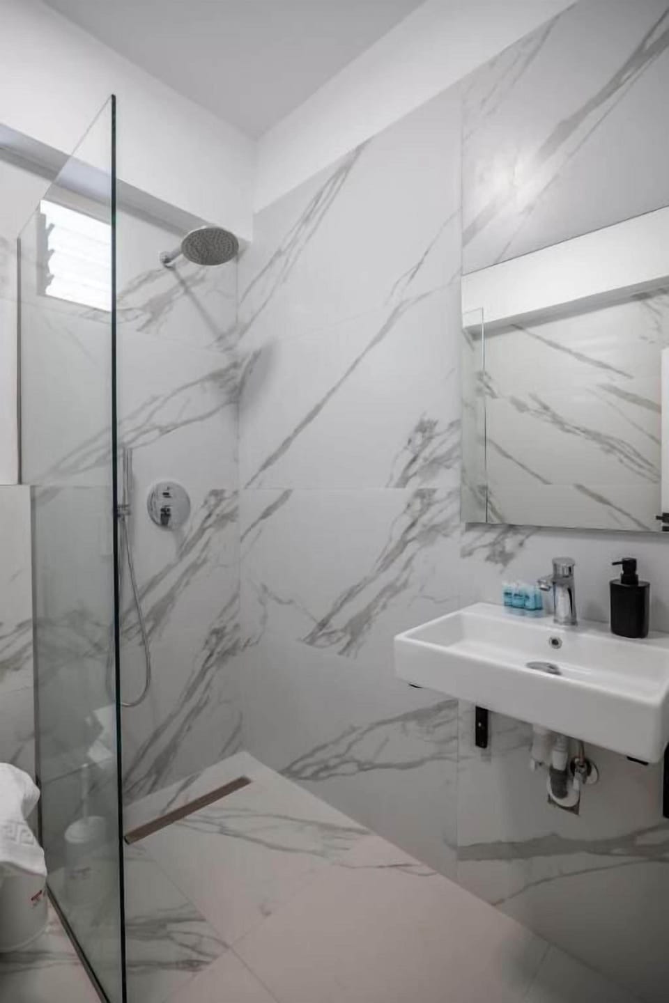 Shower, hair dryer, towels, toilet paper