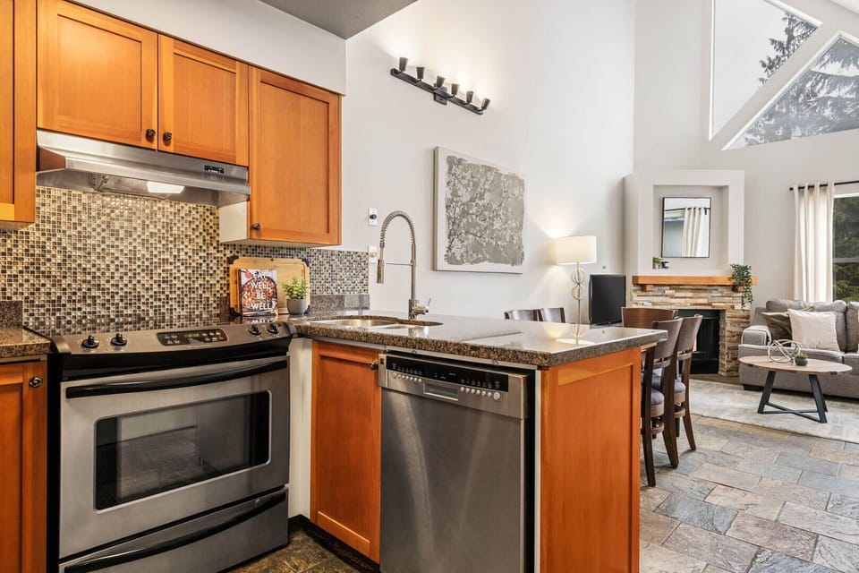 Fully equipped kitchen with granite counters & stainless steel appliances