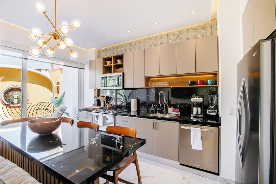 Fully equipped kitchen featuring a convenient breakfast bar