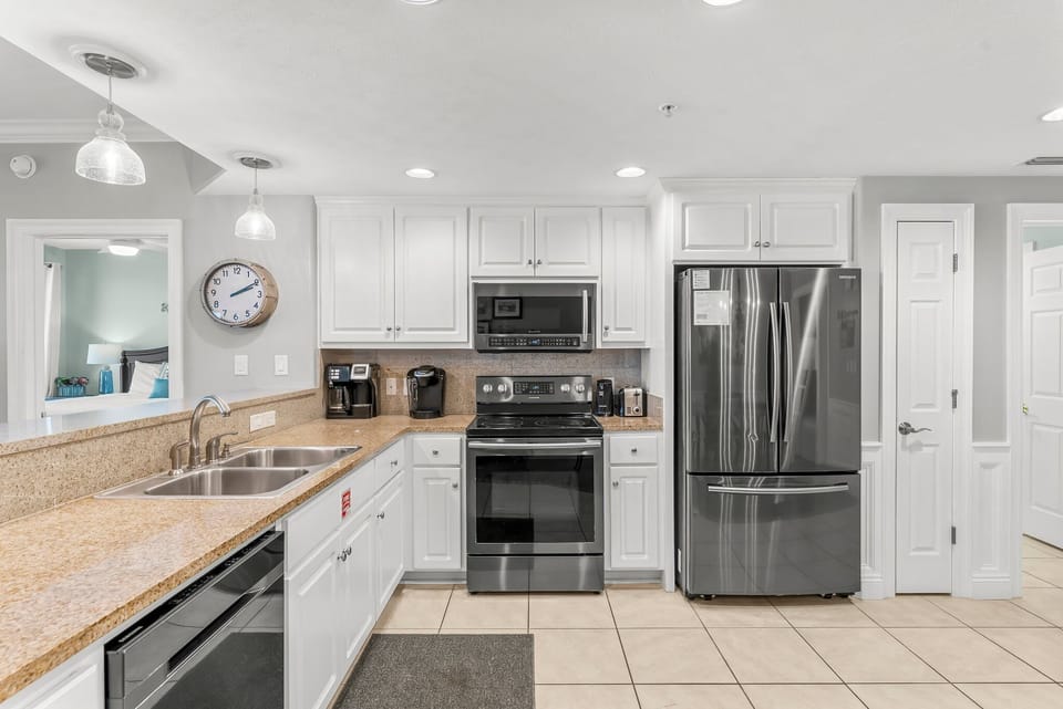 Modern kitchen with stainless steel appliances and granite countertops