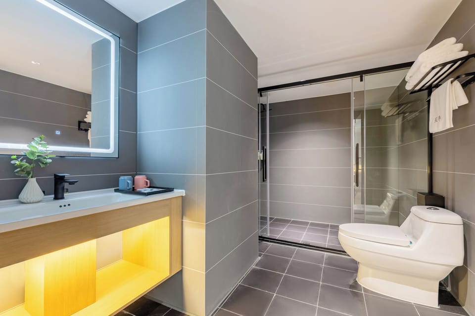 Bathtub, hair dryer, towels, soap