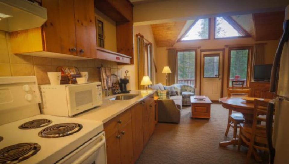A bright and inviting open-concept layout offers a seamless blend of rustic charm and modern comfort.