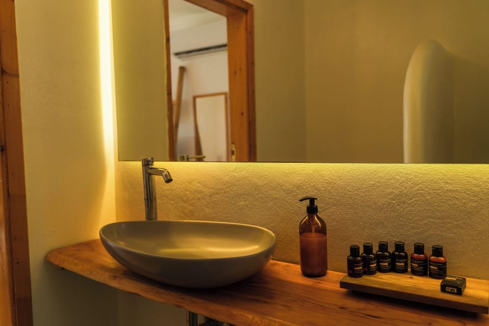 Deluxe Double Room, Beach View | Bathroom | Shower, hair dryer, towels, soap