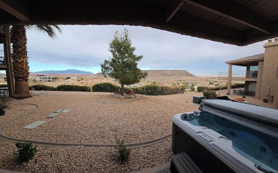 Unwind in your private hot tub while taking in breathtaking red rock and desert views from the back patio.
