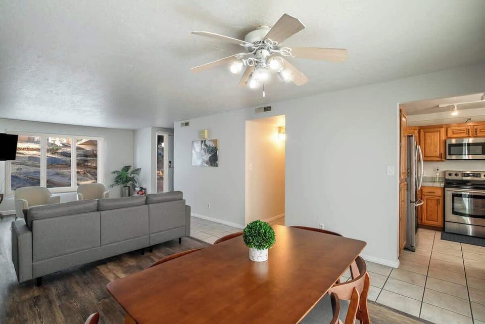 Spacious open-concept living and dining area with seamless flow into the kitchen, perfect for gathering and entertaining.