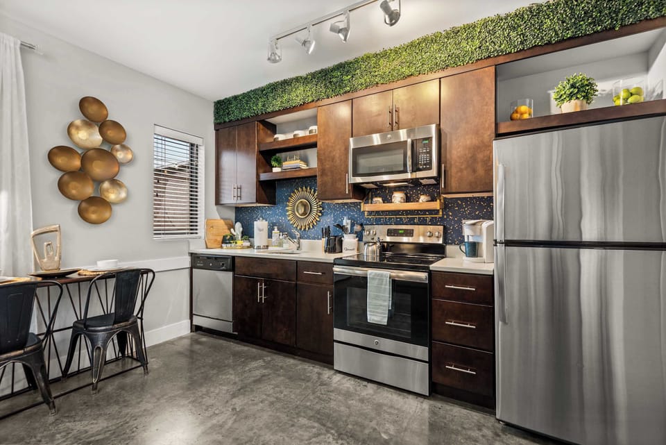 Kitchen counter with black cabinets and appliances
