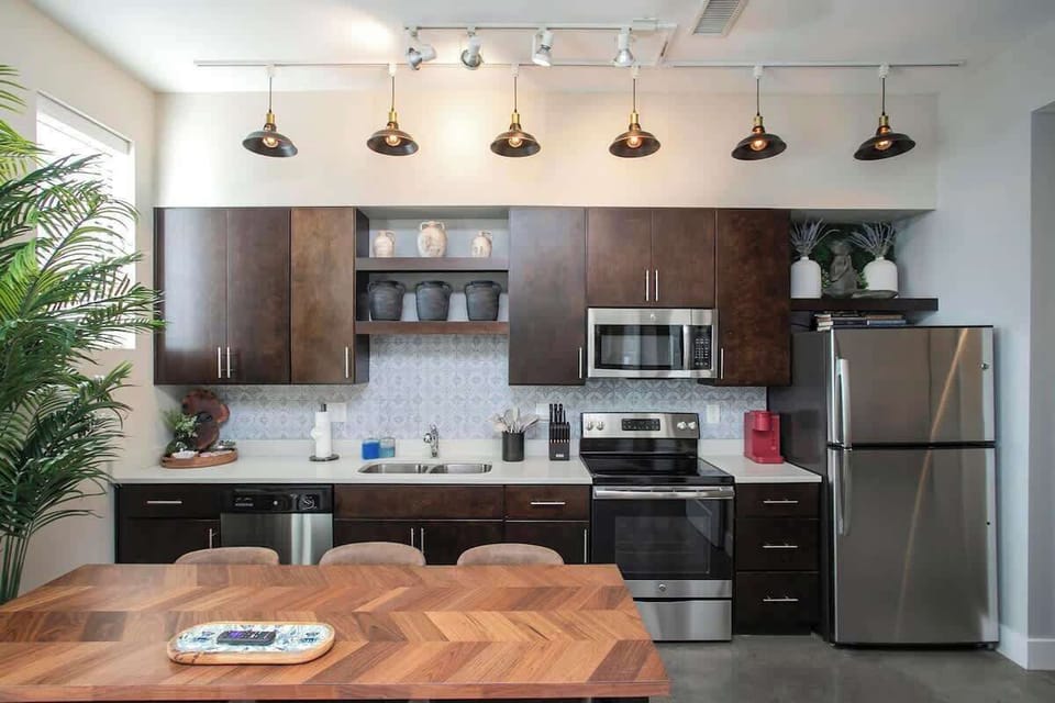 Fully stocked kitchen with full-size fridge, range and microwave