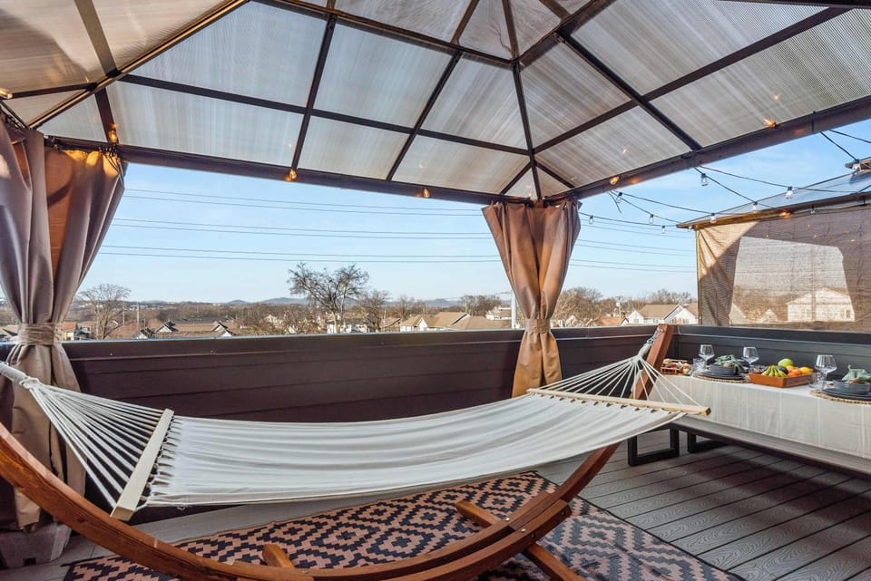 Private deck with hanging hammock chair