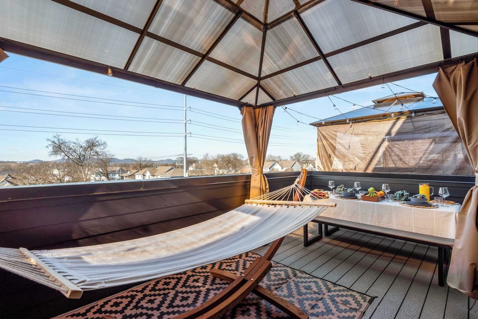Private deck with hanging egg chair