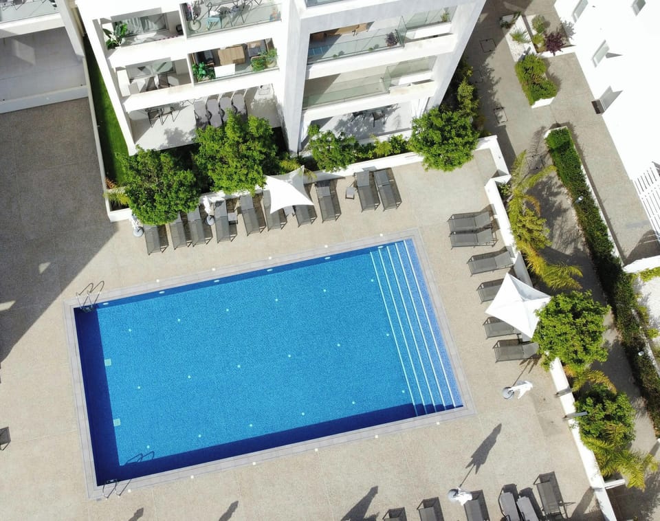Beautiful Communal Pool with sun lounger