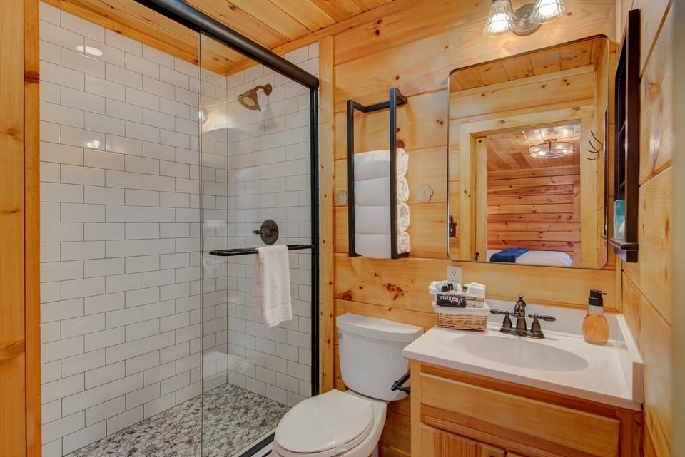 Clean and cozy, this pine-wrapped bathroom at Squirrel's Leap makes freshening up feel like part of the retreat.