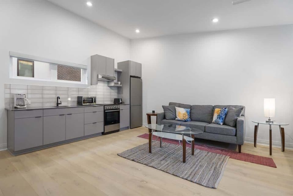 A fully equipped kitchen is included within the open space, offering convenience for cooking.