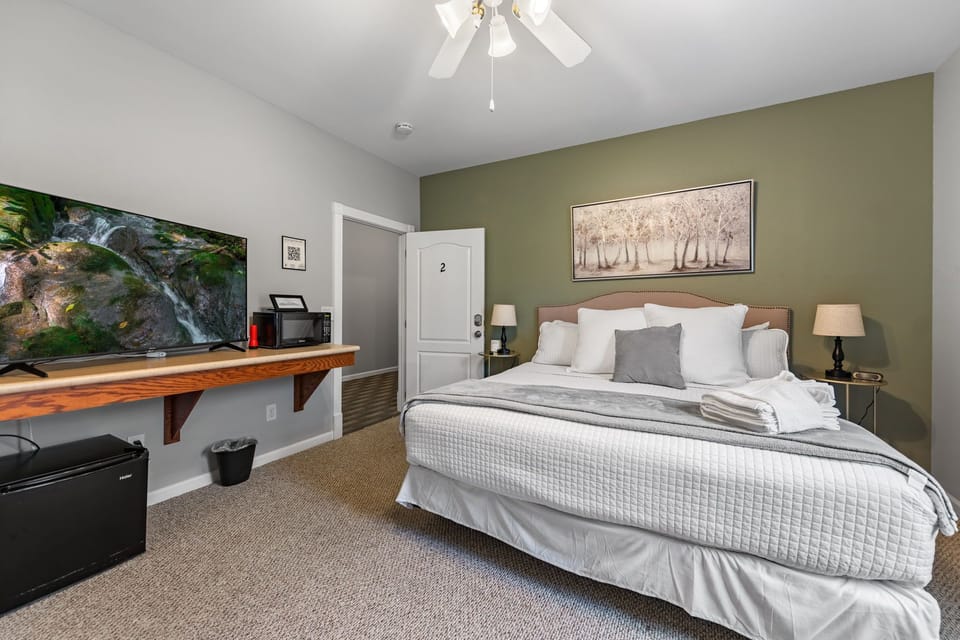 Rest and recharge in the plush king-sized bed, perfect for a peaceful night’s sleep.